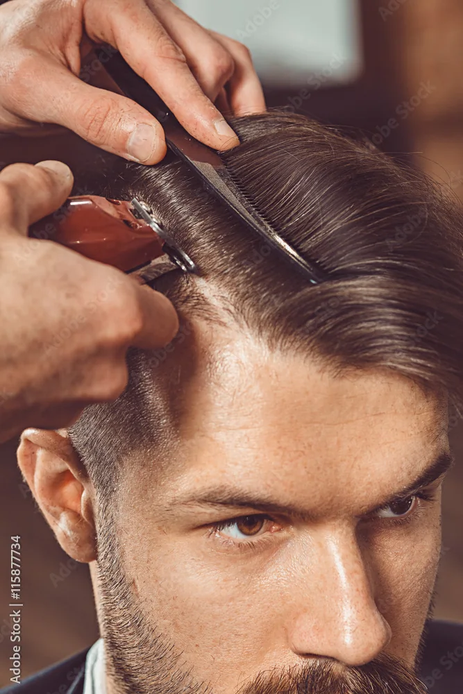 Close-up of clipper work at the hairline — pure precision